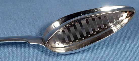 A large George III Irish silver strainer spoon, Length; 13 ¼”/337mm Weight: 4.6oz/130 grms.